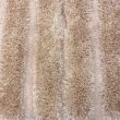 Denne produkten heter Moody Bow, laget av Polyester materiale med en vakker Beige farge – SE Mattor