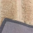 Denne produkten heter Moody Bow, laget av Polyester materiale med en vakker Beige farge – SE Mattor